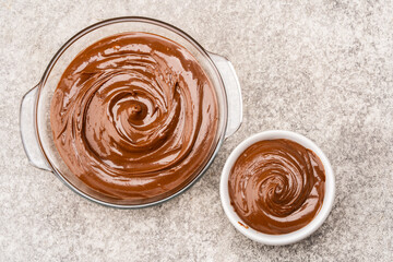 Cream chocolate in a bowl on a vintage background
