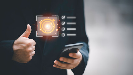 Business planning concept and strategic goal setting and with a businessman pointing at a target icon and checklist. Ideal for success, productivity, project execution and leadership content.