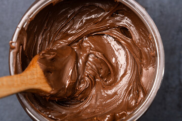 Cream chocolate in a bowl on a black background