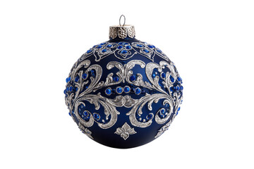 A dark blue Christmas ornament with silver filigree and blue jewels against a black background