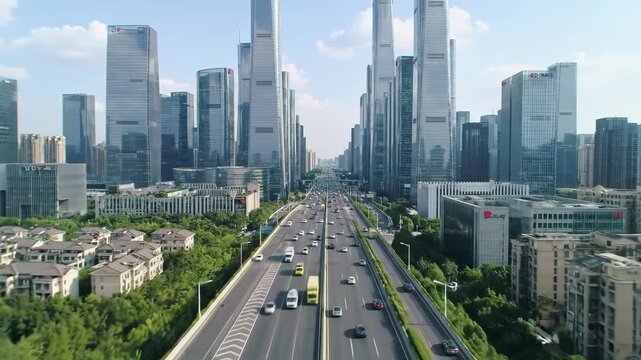 Aerial video of a vibrant, futuristic metropolis. Gleaming glass skyscrapers, multi-lane highways with fluid traffic, and lush green suburbs under diffused sun. Concept of organized urban