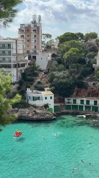 Cala Santanyi bay panoramic view close up in sunny day. Hills with villas and hotels over the sea on Mallorca island in Spain.