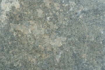 Scratched and weathered metal surface texture.
