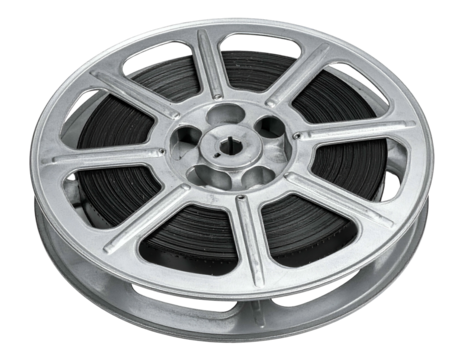A silver film reel, filled with black film, sits against a dark background