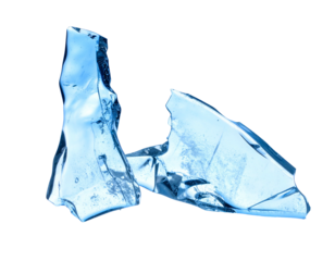 Shattered, translucent blue object against a stark black background