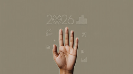 Hand reaching for 2026 goals with business charts and target icons representing future growth and success in a modern digital presentation