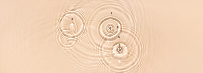 water texture ripples wave clean transparent water abstract background in beige color