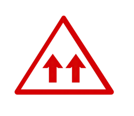 Red triangular road sign with two vertical arrows, indicating two-way traffic. Isolated on black