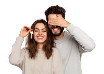 Happy Young Couple Holding Keys to Their New Home isolated on a transparent background