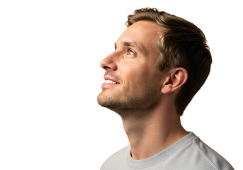 Obraz premium Smiling young man looking upward with hopeful expression, side profile isolated on white background