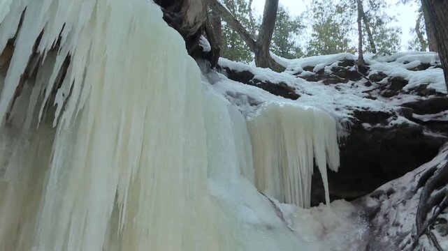 Ice Formations At The Popular Winter Destination In Eben Ice Caves Near Eben Junction In Michigan's Upper Peninsula. Low Angle Shot