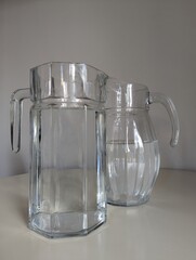 Two jugs ready with fresh water, promoting hydration and healthy choices. A clean, lifestyle-focused image.