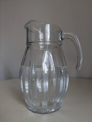 Fresh, clean drinking water in a clear glass jug. Symbolizing hydration, health, and a pure lifestyle.
