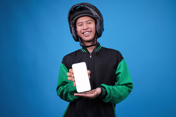 Male Online Delivery Driver in Uniform and Helmet Holds Mobile Phone With White Display