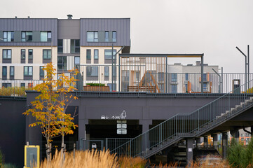 modern urban apartment complex highlights contemporary architecture and rooftop terrace with...