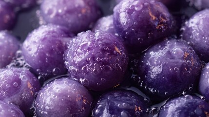 Purple plums close up wet droplets
