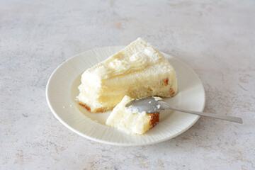 Delicious Slice of Fluffy White coconut Cake on a Plate