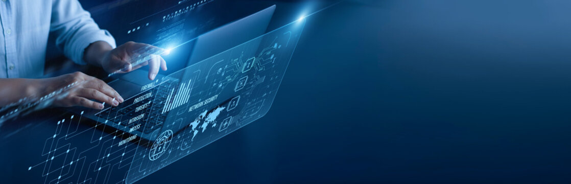 Network Security network connection concept. Security analyst hand working on a laptop computer with graphical firewall protection intrusion detection encryption cyber defense analytics.