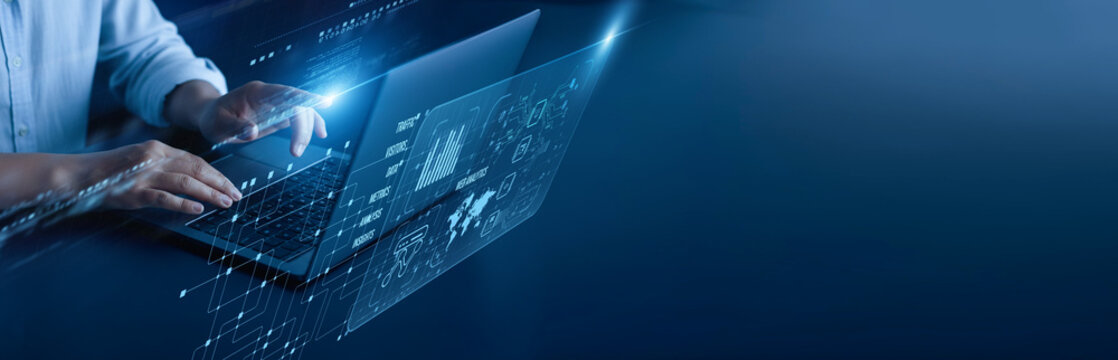 Web Analytics network connection concept. Marketing analyst is hard at work on a laptop computer with graphical data metrics traffic visualization performance conversion, and an insight dashboard.