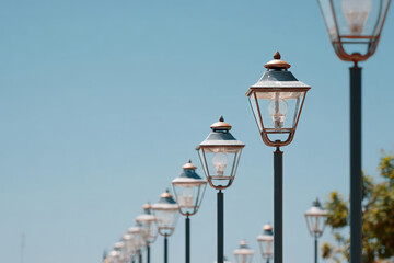 Scenic walkway with vintage street lamps and greenery