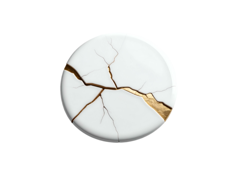 A white circular object, broken and repaired with gold, on a black background