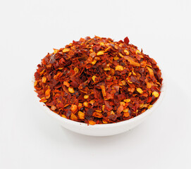 Crushed Red Chili Flakes In White Bowl, Fiery Spice For Cooking And Garnish