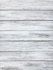 Fototapeta premium Overhead view of white painted wood planks creating a rustic background in a studio setting for creative projects