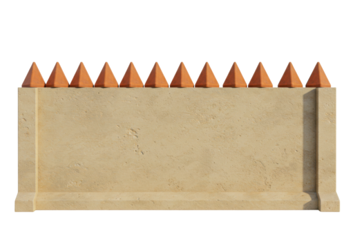Isolated tan stone wall with pyramid caps, architectural fence feature, boundary element