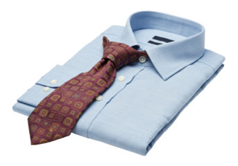 Isolated folded light blue dress shirt with patterned tie, a traditional business attire