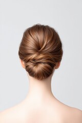 Fototapeta premium Elegant Low Bun Hairstyle with Smooth Finish and Natural Shine