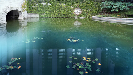 Tranquil Urban Artificial Park Lake with Calm Reflective Water Surface