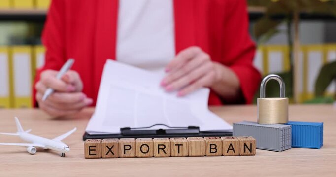 Exploring the implications of an export ban through hands-on documentation and thoughtful analysis at a busy workspace