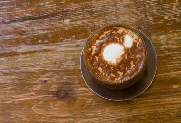 Delicious cappuccino with creamy foam and chocolate powder perfect for coffee lovers to enjoy