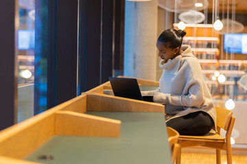 Student Studying in Modern Library