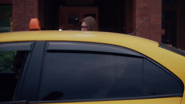 Elegant women dressed in luxurious fur coats catching a taxi on a vibrant modern street.