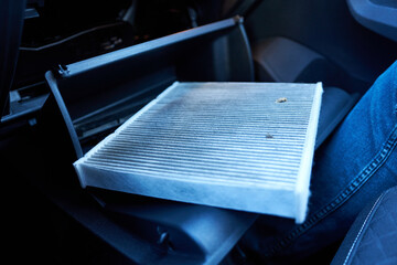 Car air filter. Dirty air filter. Car air conditioning. Replacing the air filter.