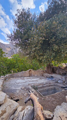 Old stonework and autumn trees in a serene outdoor setting, blending cultural heritage with seasonal beauty and natural tranquility.  
📍Hawraman Takht, Kurdistan 