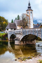 Fototapeta premium Lake Bohinj bathed in autumn magic. The kingdom of the golden-horned ibex.