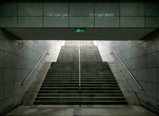 Stairs rise toward bright light, creating a serene urban scene