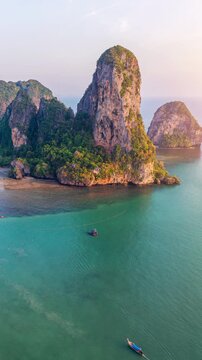 Railay beach with long tail boat in Krabi, Thailand.