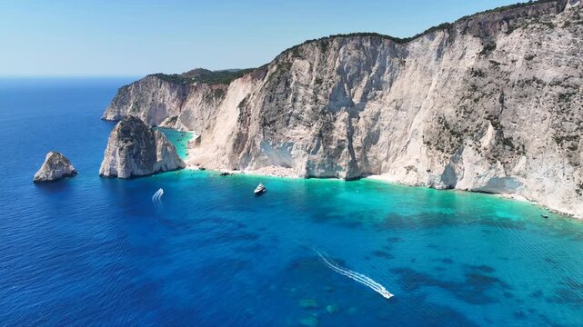 Aerial drone cinematic video from scenic viewpoint to small iconic islets of Mizithres a true paradise tourist place visited by yachts and sail boats in island of Zakinthos, Ionian Sea, Greece