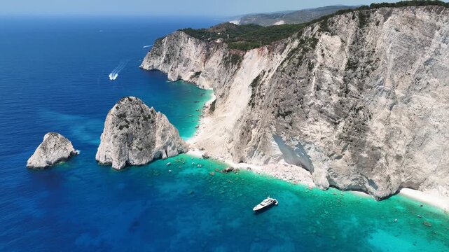 Aerial drone cinematic video from scenic viewpoint to small iconic islets of Mizithres a true paradise tourist place visited by yachts and sail boats in island of Zakinthos, Ionian Sea, Greece