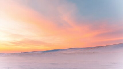Fototapeta premium Soft pastel sunrise over a snow-covered landscape with gentle rolling hills dawn morning