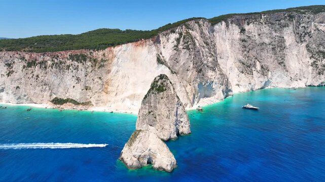 Aerial drone cinematic video from scenic viewpoint to small iconic islets of Mizithres a true paradise tourist place visited by yachts and sail boats in island of Zakinthos, Ionian Sea, Greece