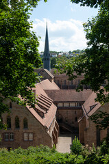 Aerial view of Maulbronn Monastery, Cistercian abbey, tall church tower, inner cloister courtyard, medieval complex, UNESCO World Heritage Site, symmetrical layout, historical landmark, travel destina