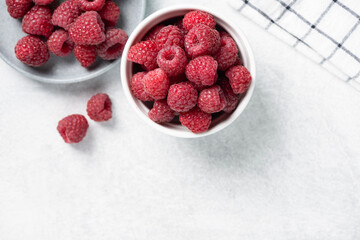 Raspberries in bowl. Healthy fresh summer berry harvest