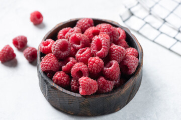 Raspberries in bowl. Healthy fresh summer berry harvest