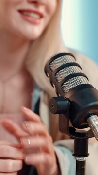 Microphone, podcast and woman in studio, speaking and recording broadcast with content creation. Person, guest and radio with equipment, influencer or media agency with live streaming and questions