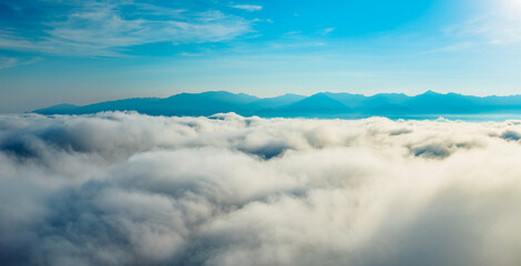 Magnificent sea of clouds and mountain scenery in the blue sky
