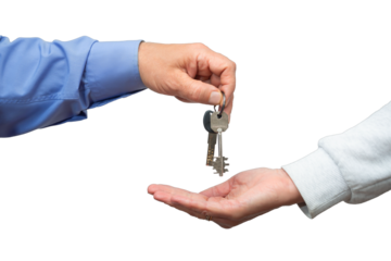 Keys are passed between hands, marking the excitement of a new home purchase